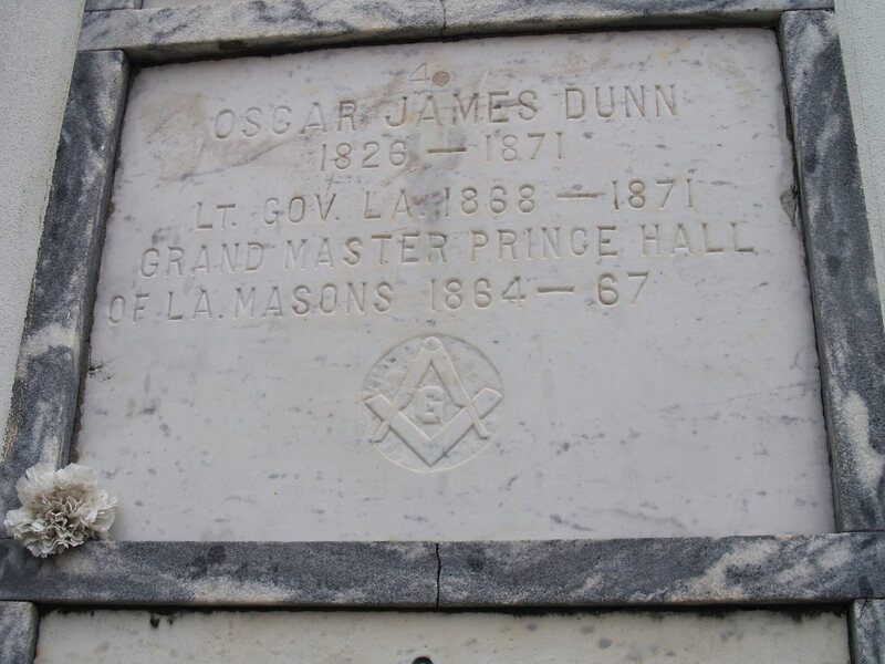 The plaque at Oscar Dunn's tomb in St. Louis Cemetery. 