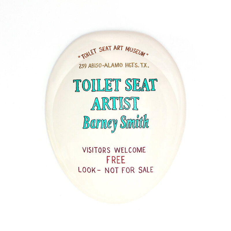 The sign for the museum is, appropriately, on a toilet seat. 