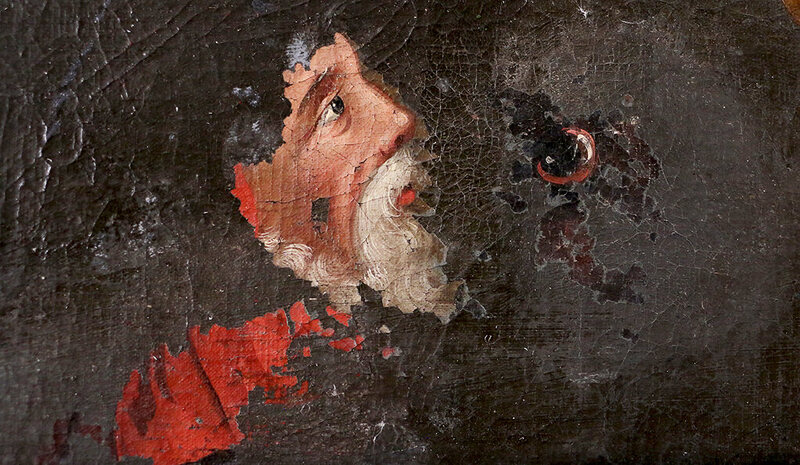 The face of a Catholic cardinal emerges from the overpaint. 
