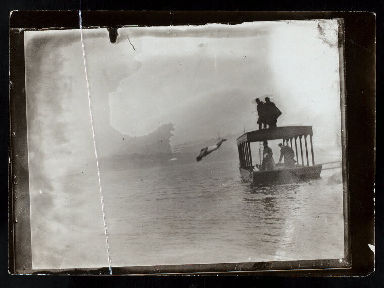 Harry Houdini diving handcuffed into the water