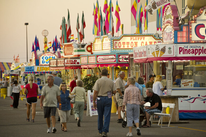 Strolling by carnival food stands at the Nebraska State Fair, Grand Island.