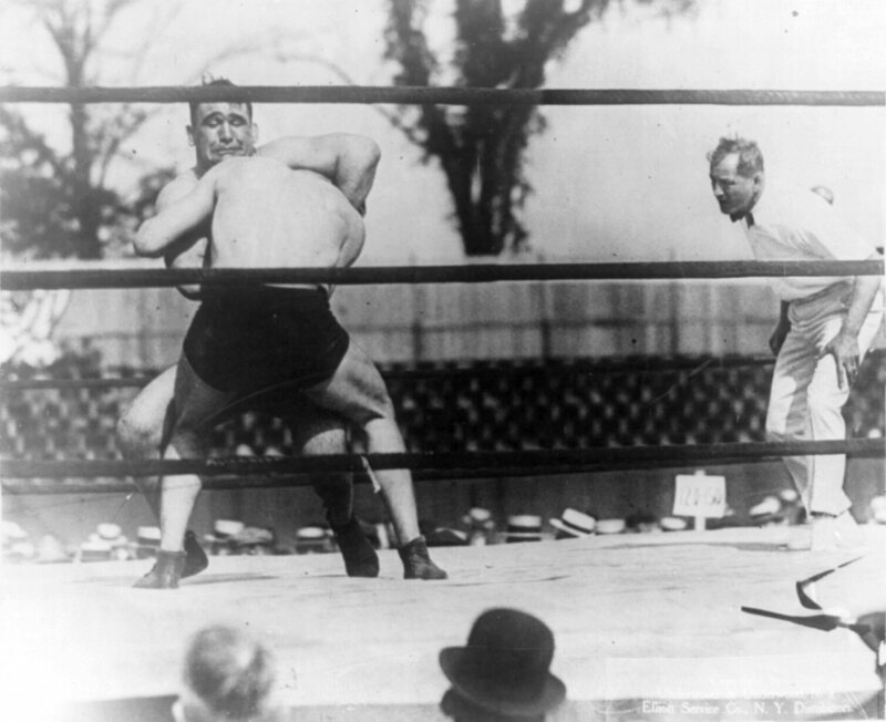 Ed Lewis applying his signature move, the headlock, on Ivan Linow in 1920. Lewis went on to be defeated by newcomer Wayne Munn in 1925.