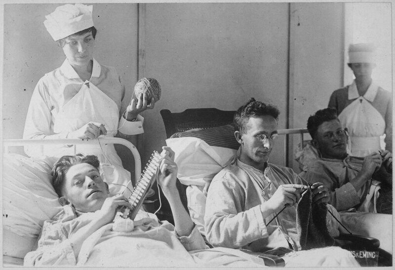 Bed-ridden soldiers knit during World War One. 