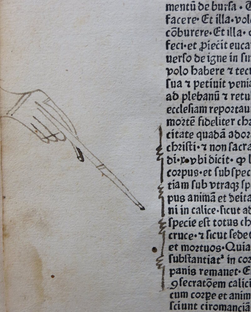 A large manicule with nails. 