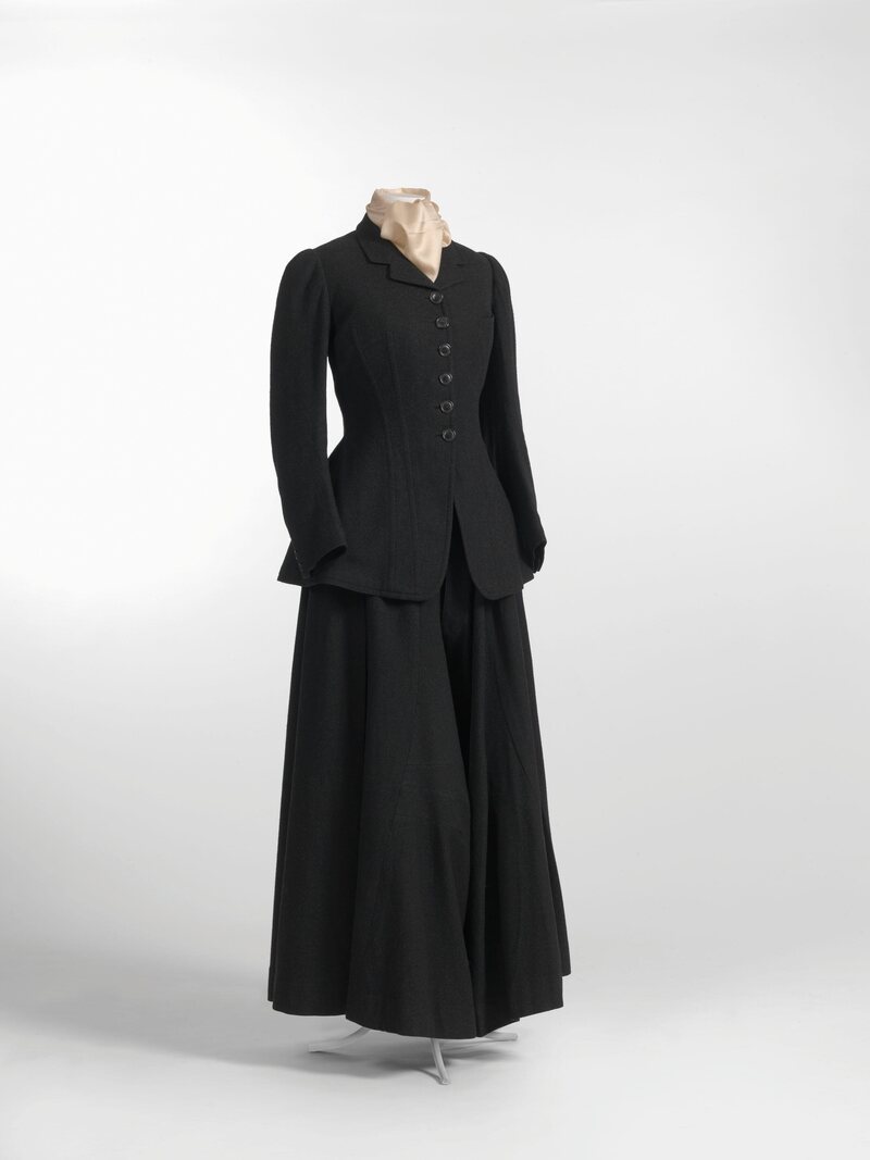 This riding habit, from around 1900, features a divided skirt, barely visible below the jacket.