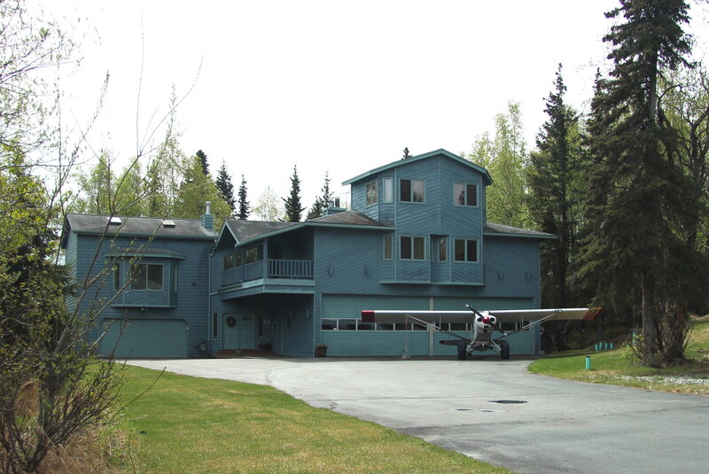 Residents of Cange Street have airplane hangars in their homes and live alongside a neighborhood runway.