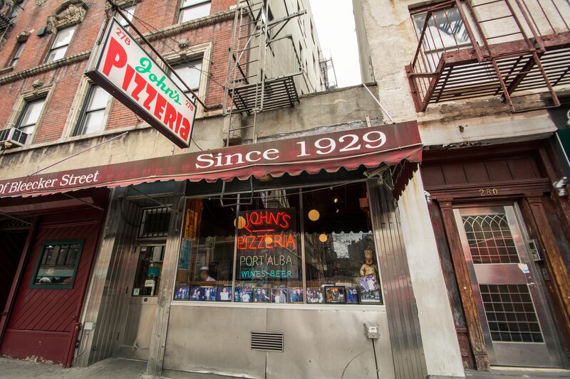 John's Pizzeria in New York City. They advertise "no slices" on the other side of their awning. 