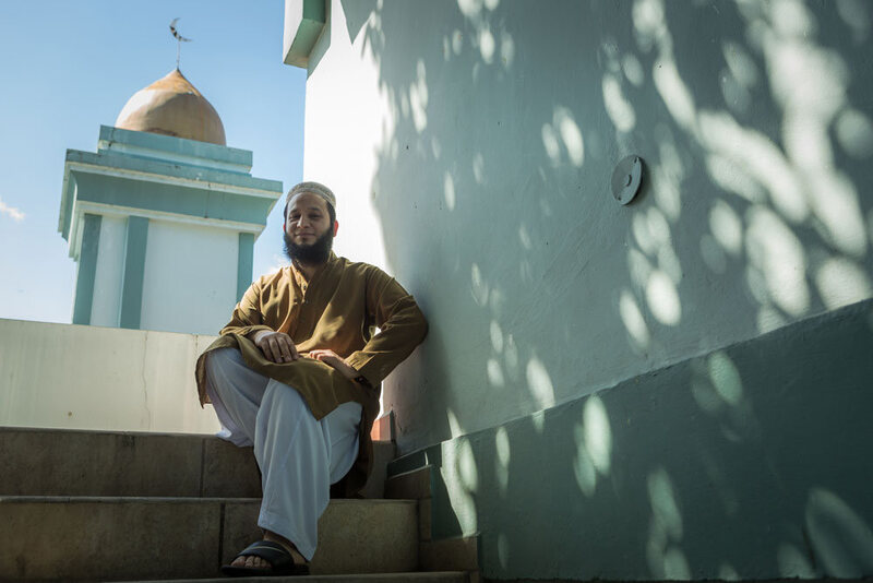 Iman Mohammed, who was born in Pakistan, poses for a portrait after Friday prayers.
