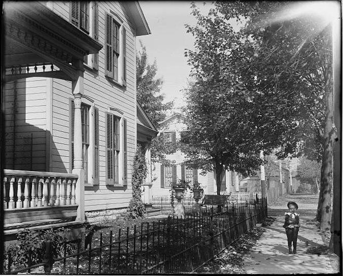 A young man on a street in Dayton, Ohio, c. 1900.