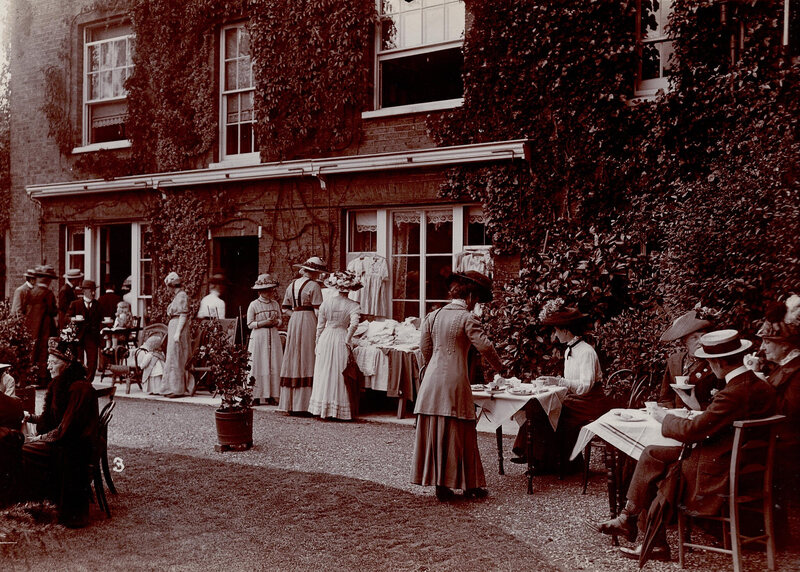 A garden party using "suffragette china."
