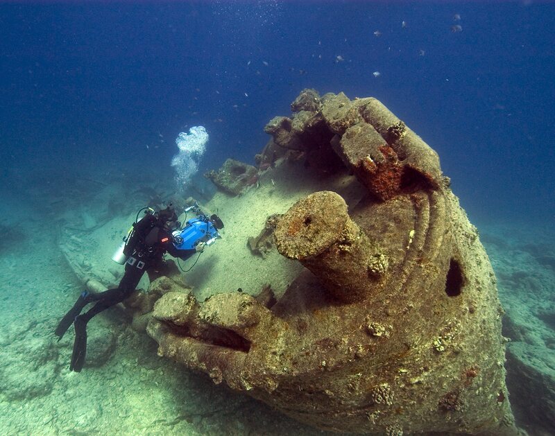 Wrecks stand to see a number of threats in a changing ocean. Here, NOAA diver John Brooks a ship off the coast of Hawaii. 