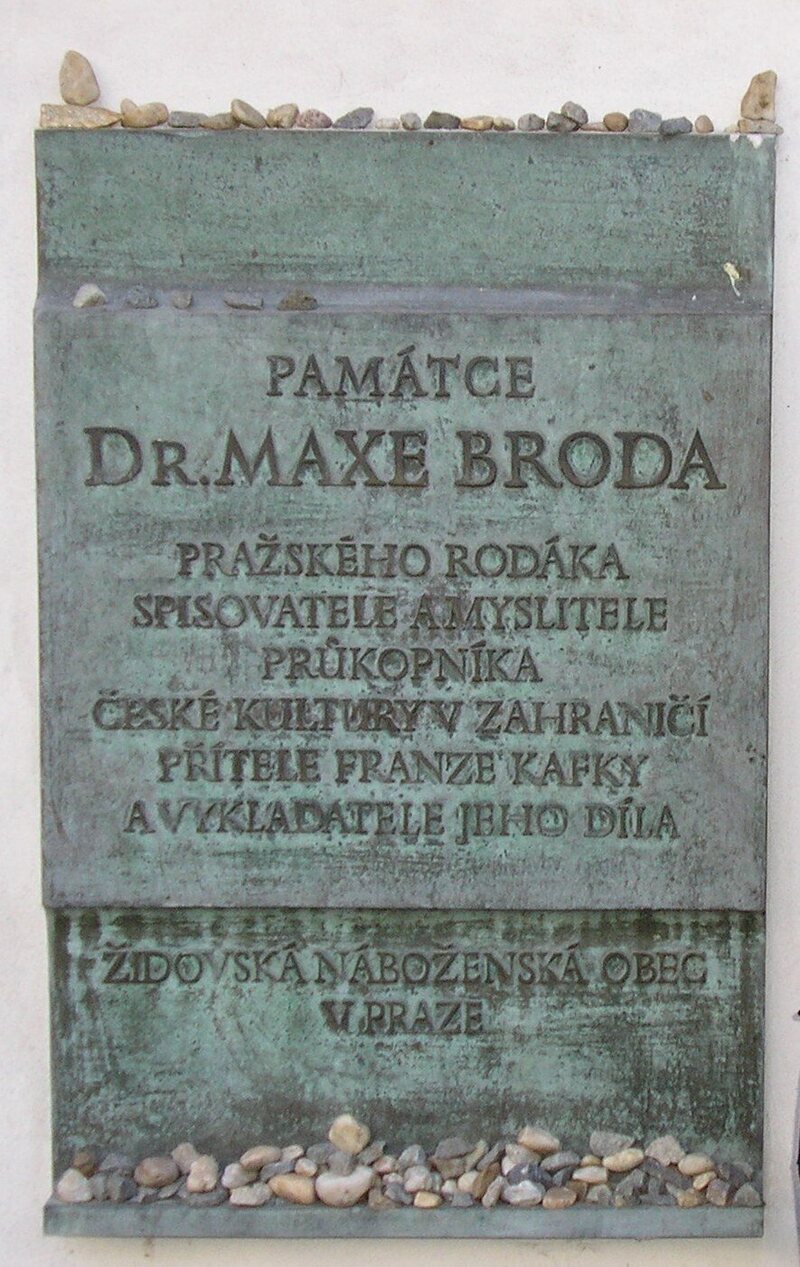 A plaque opposite Kafka's grave in the new Jewish cemetery in Prague commemorates Brod's contributions to the author's legacy. 