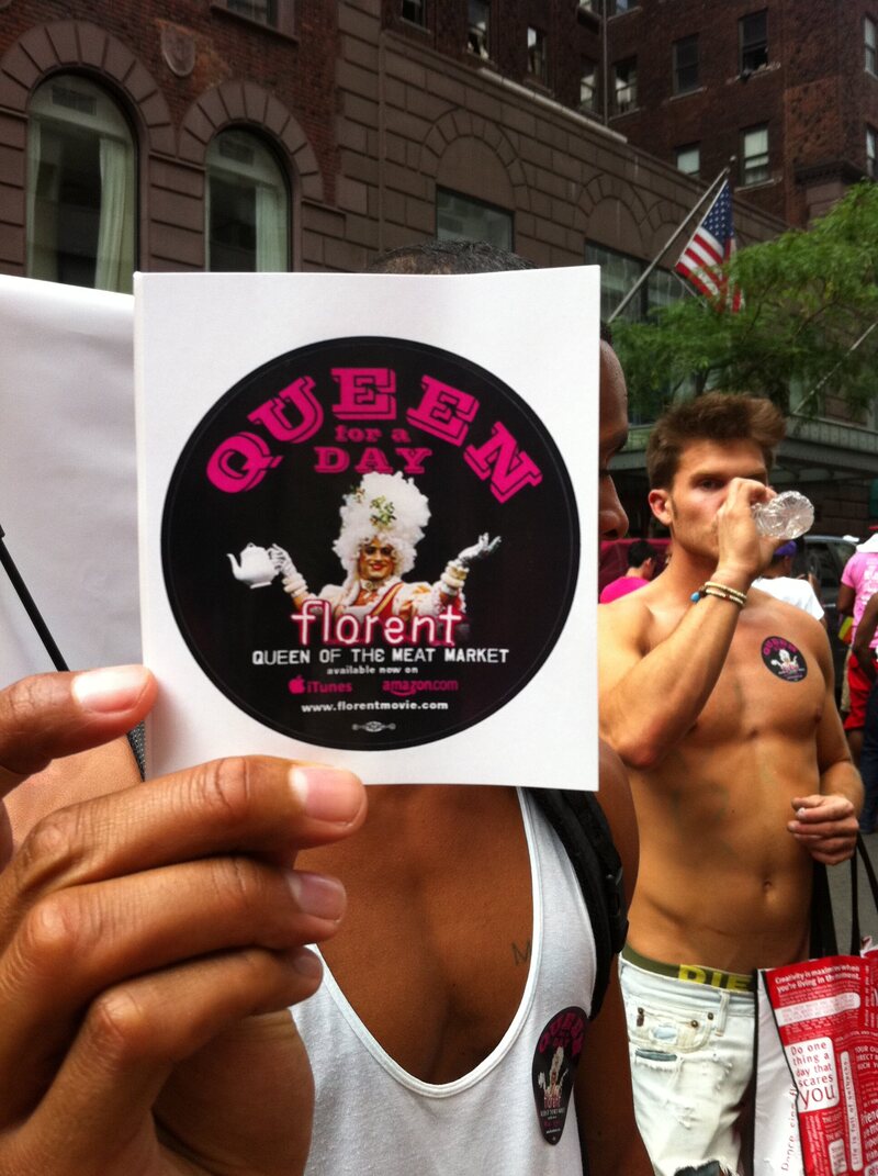 Someone holds up a sticker of Florent's film at New York's Gay Pride March in 2011.