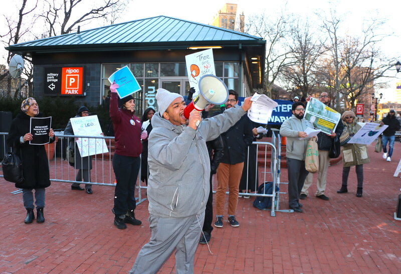 Activist Anthony Diaz protests against high lead levels in Newark's water.