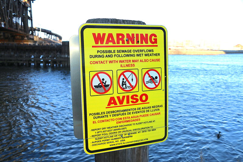 A sign warns visitors against fishing from the Passaic River in Newark.