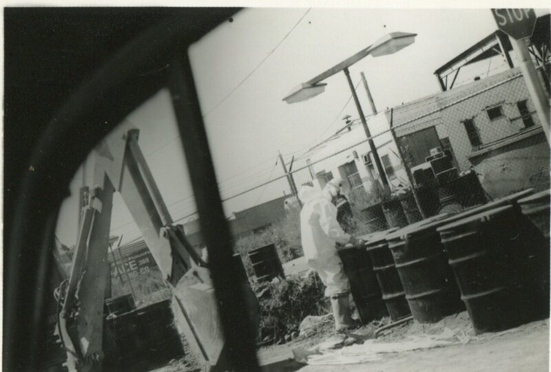 Federal workers wear hazmat suits to clean dioxin in 1983.
