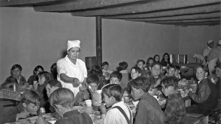 Kids eat WPA school meals during the Depression.