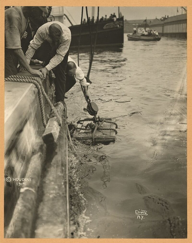 Houdini in a crate in the New York Harbor