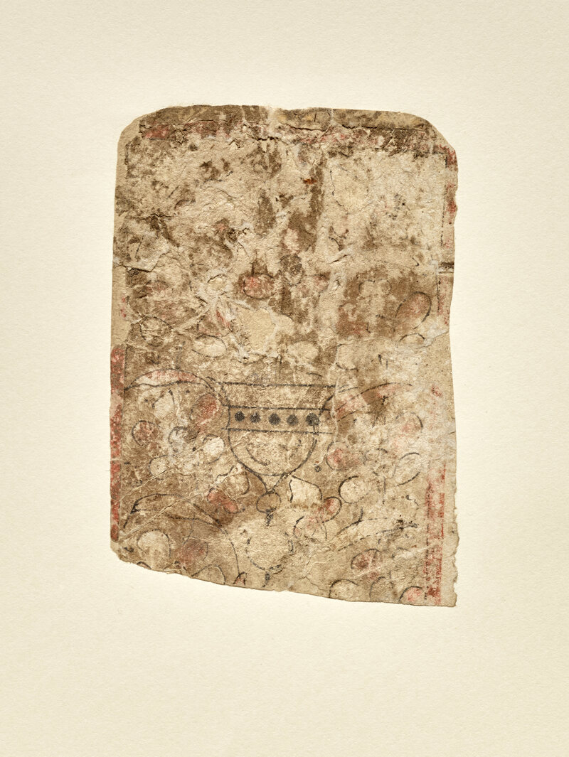 A fragment of a mid-13th-century playing card (from the suit of cups) from Egypt.