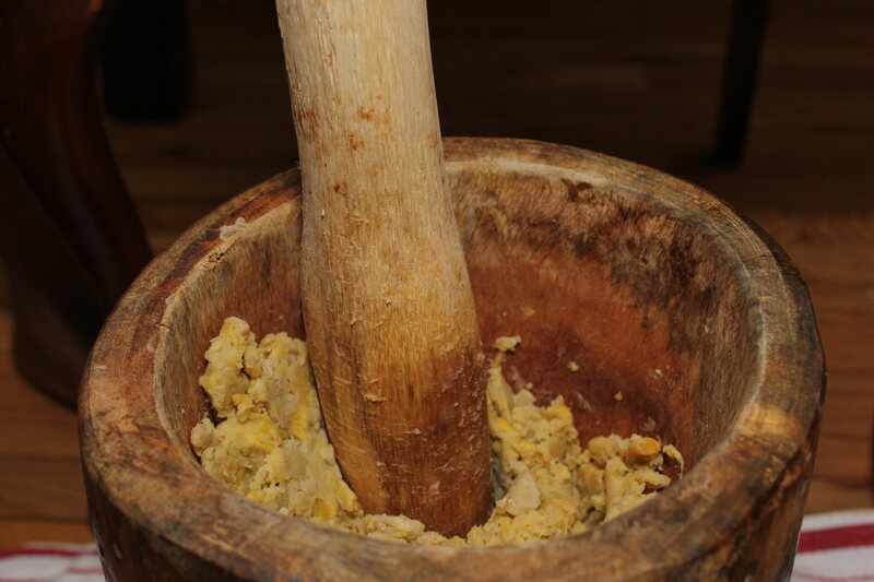 The Garifuna, as well as other Caribbean communities with West African roots, pound plantains to make starchy <em>fufu.</em>