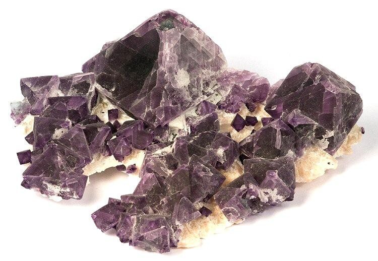 Purple fluorite similar to this specimen mined in China can be found at the Museum of Minerals and Crystals.