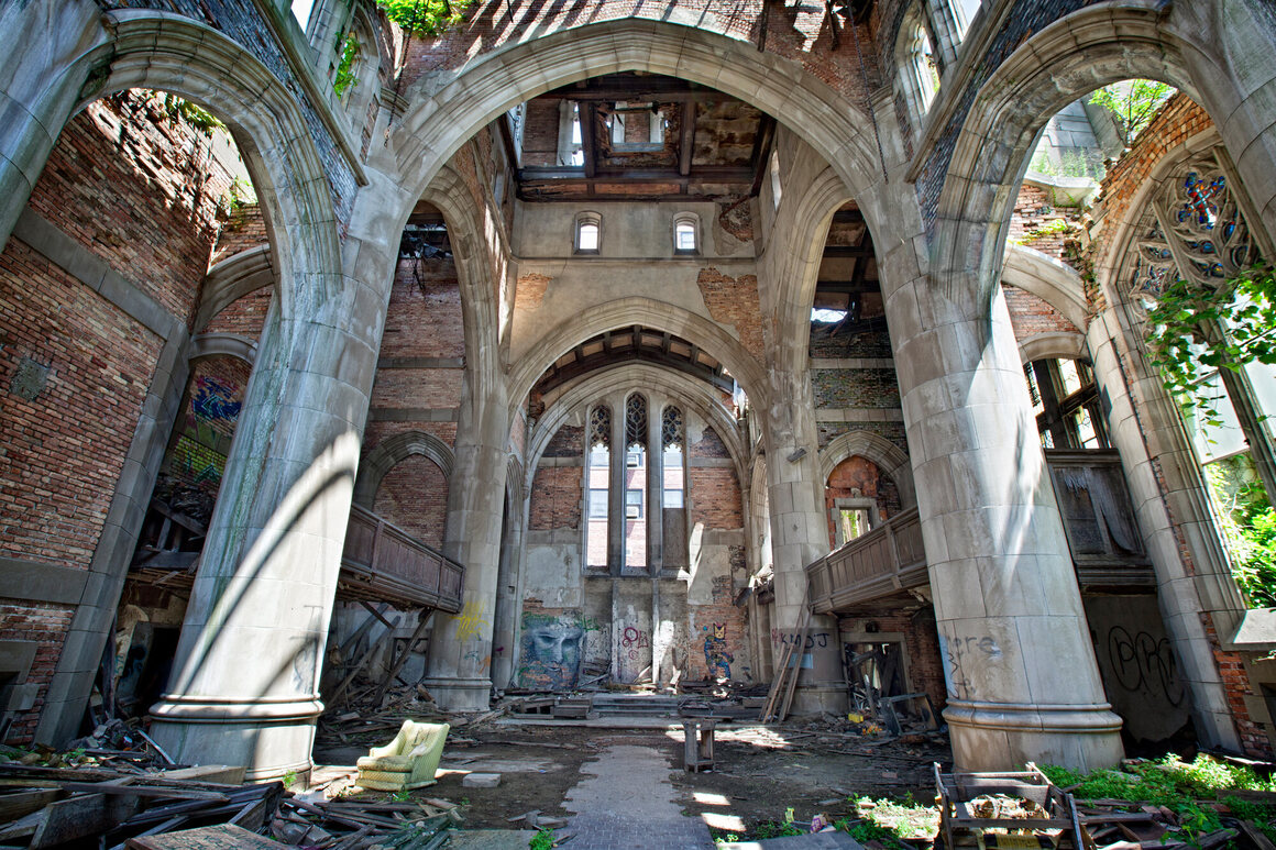 Sunlight filters in through the collapsed roof of City Methodist Church.