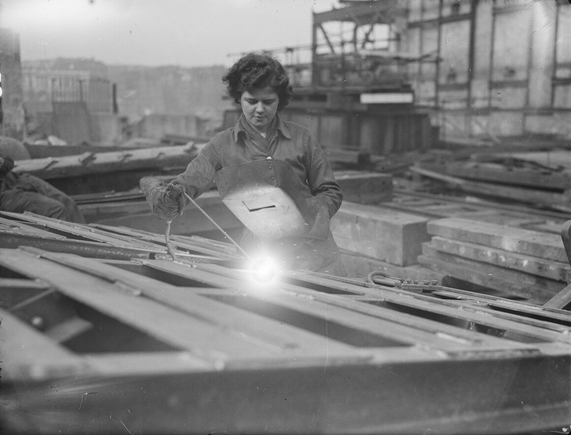 A welder, identified as "Dorothy," at work.