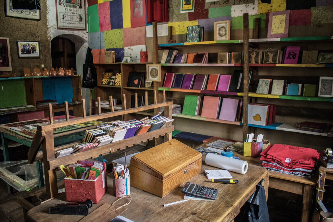 The workshop’s small gift shop is filled floor-to-ceiling with handmade books, posters, and notebooks.