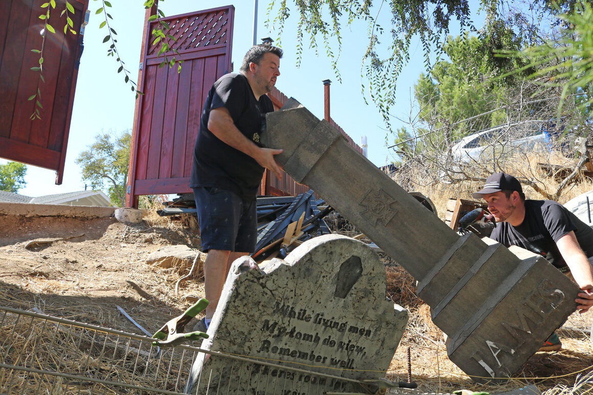 Yu (left) and Bolton set the stage for their cemetery-themed home haunt.