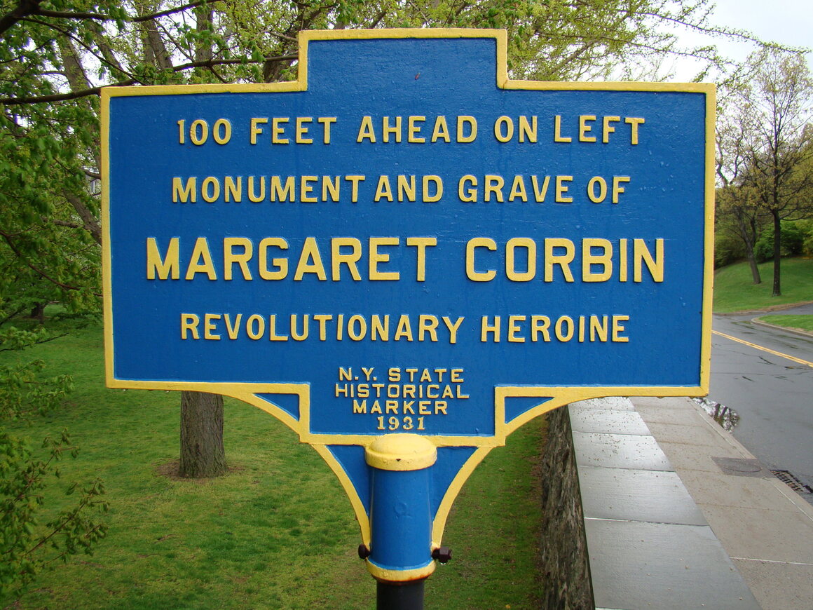 This sign directs visitors to the United States Military Academy to the purported site of Margaret Corbin's grave.