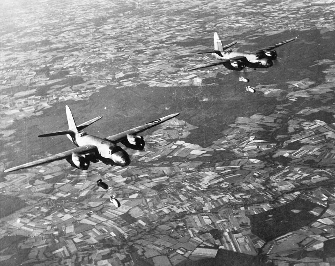 Two B-26 Marauder bombers of the U.S. Ninth Air Force drop bombs over Germany.