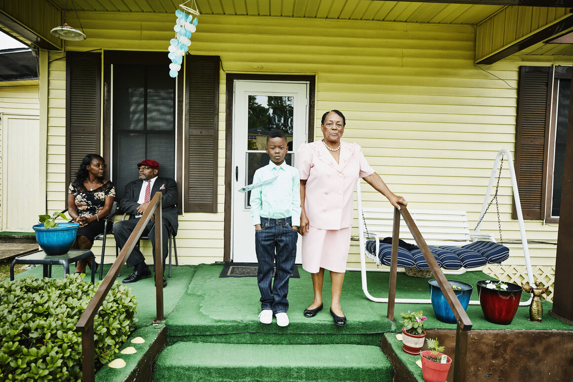 A boy and his grandmother on a porch on Texas's Gulf Shore. 
