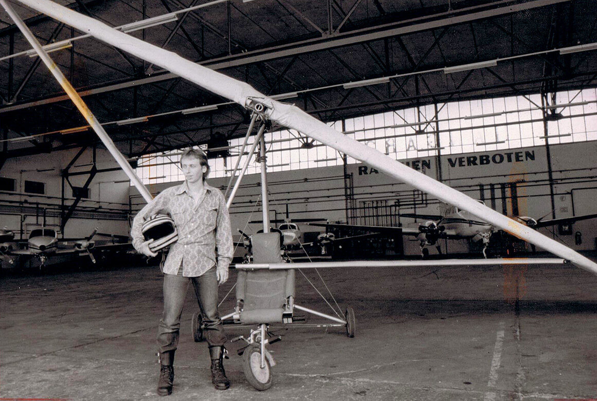 Zdarsky and his homemade power hang-glider—made from scavenged scrap metal, a wheelbarrow, an engine, and a propeller—after he used it to fly to freedom in 1984. 