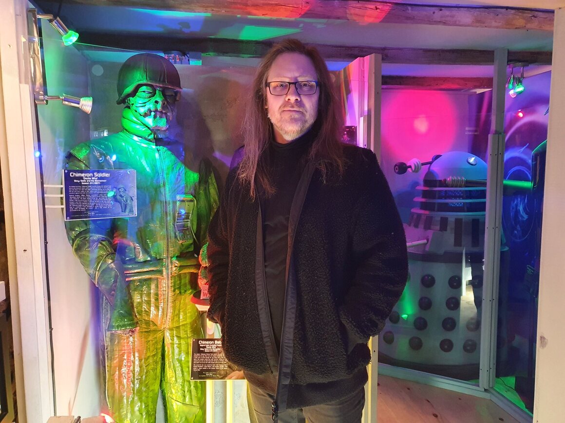 Neil Cole in his personal sci-fi museum, where <em>Doctor Who</em> has a large presence. 