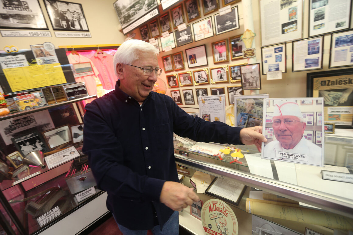 Ben Stacks admires a photo of himself in his uniform at the unofficial McDonald's memorabilia museum.