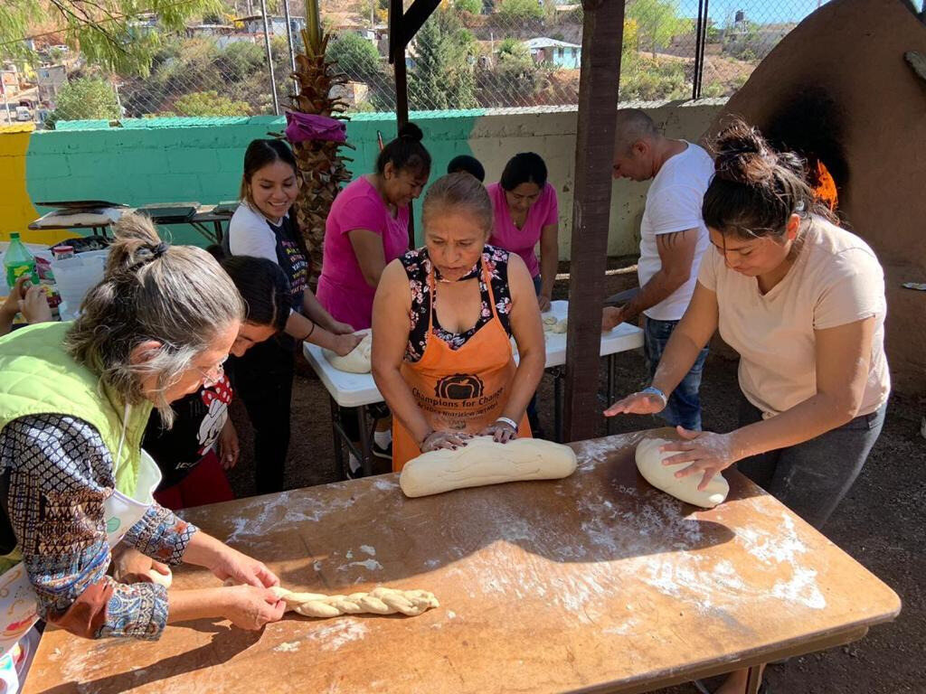Rolling out the dough before using the horno.