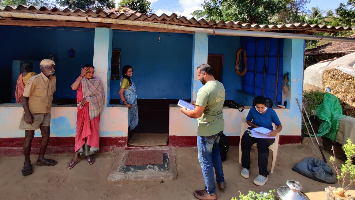 During a rescue in the village of Heggodu, members of the Agumbe Reserve Research Station chat with locals about the king cobra's importance to the ecosystem.