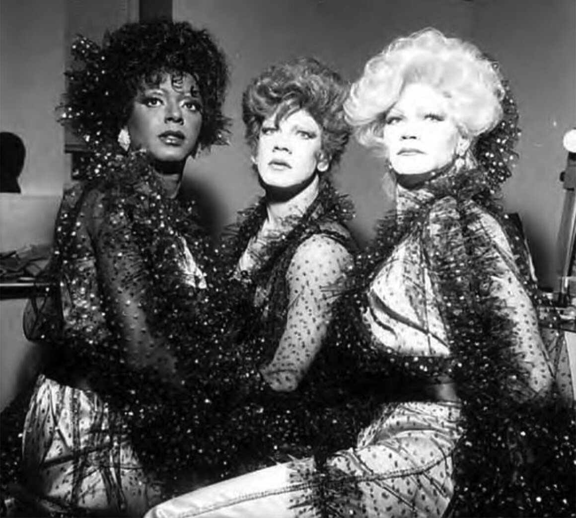 Drag performer Billie De, center, with two other performers at the Dreams and Illusions AIDS Benefit held at Broadway Performance Hall, Seattle Central Community College, Washington, April 24, 1983.