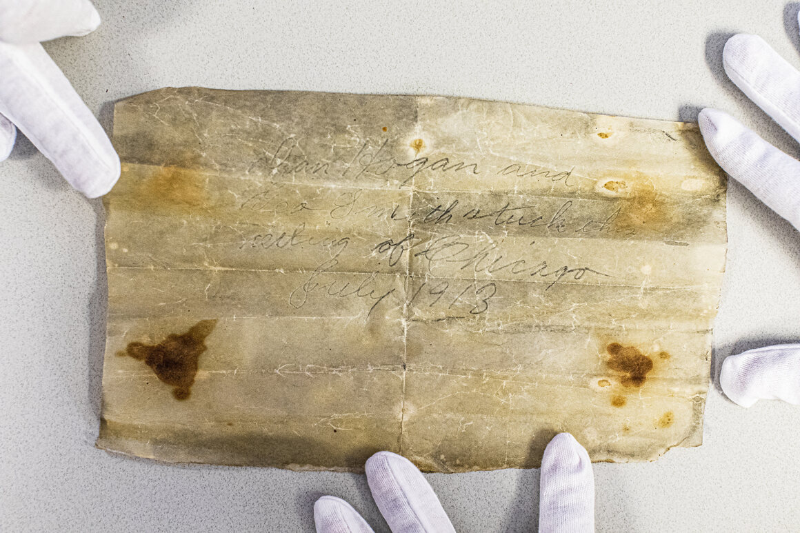 When archivists unrolled the paper, they discovered a message, but it didn't say much. 