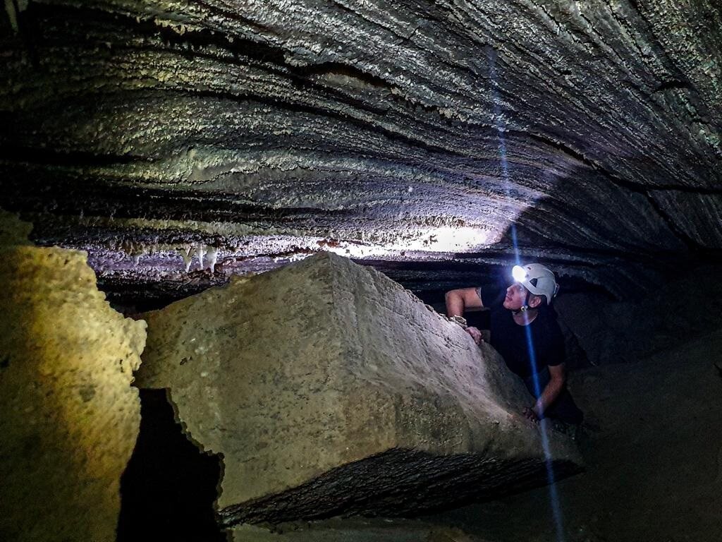 Itai Schkolnik explores a narrow portions of Malcham Cave. 