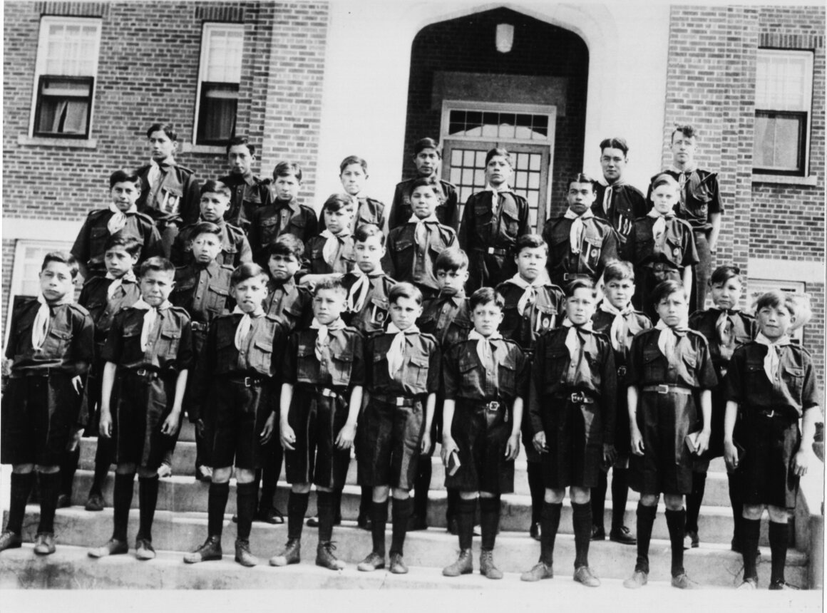Students in Boy Scout uniforms at Shingwauk Indian Residential School, Sault Ste. Marie, ON.