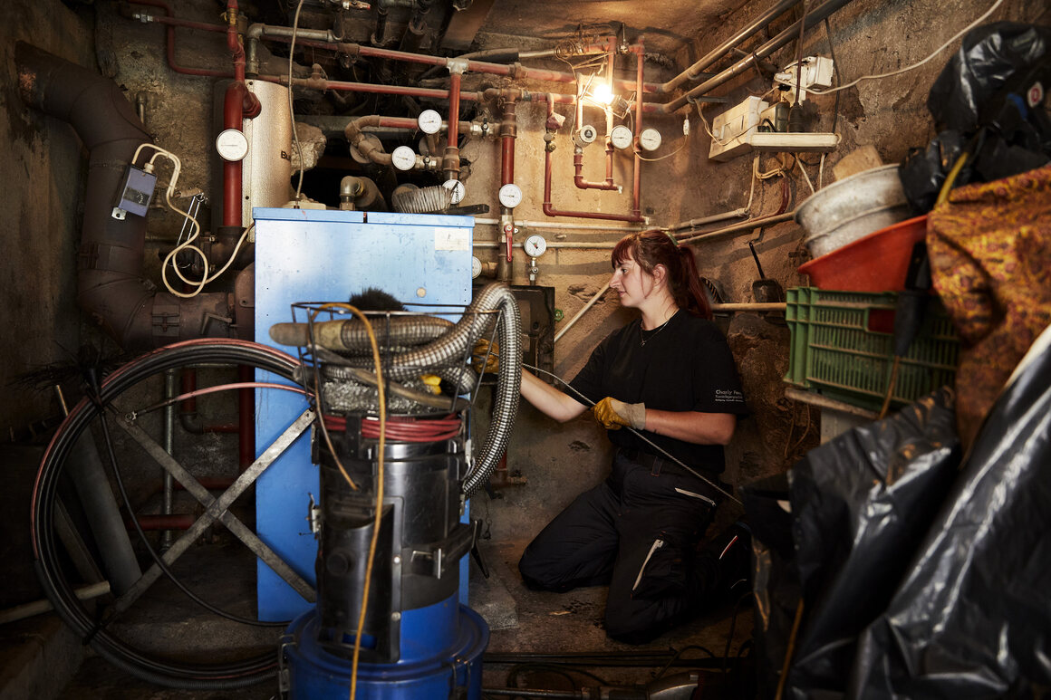 A chimney sweep can inspect five to six heating systems
          per day, depending on the size. Here, Graf cleans a
          wood-burning furnace, which needs a visit from the chimney
          sweep twice a year.