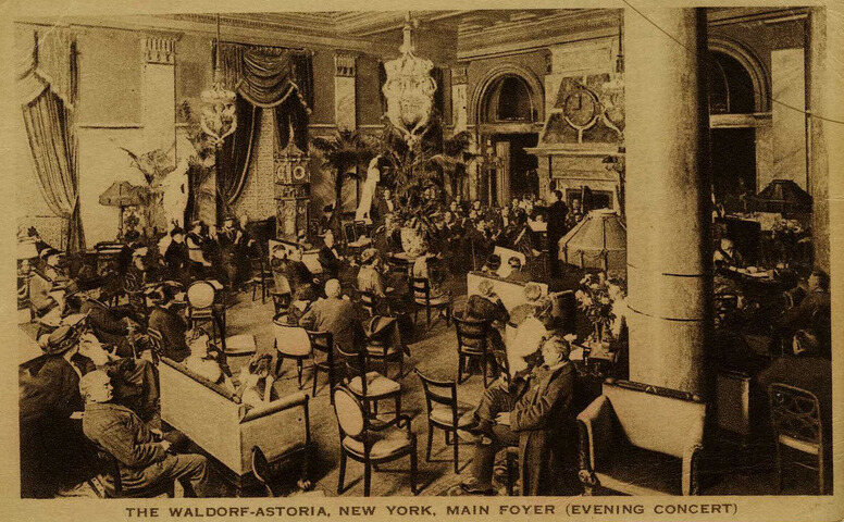 In one of the few surviving images of the clock in the original Waldorf-Astoria (upper left), during an 1918 concert. 