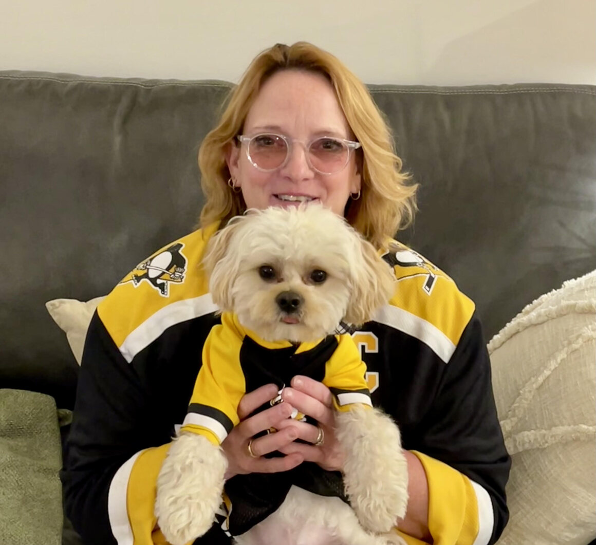 Lily Dale medium Janice Dreshman and her canine friend, Sir Tibbetts Wick, are both die-hard Penguins fans.