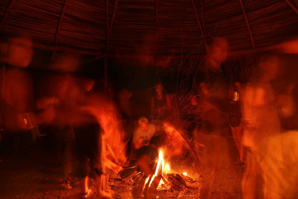 Local residents and visitors gather around a fire in a Boruca community of Costa Rica to share stories of <em>nímbulos</em>, the Mountain of Death's mischievous forest spirits.