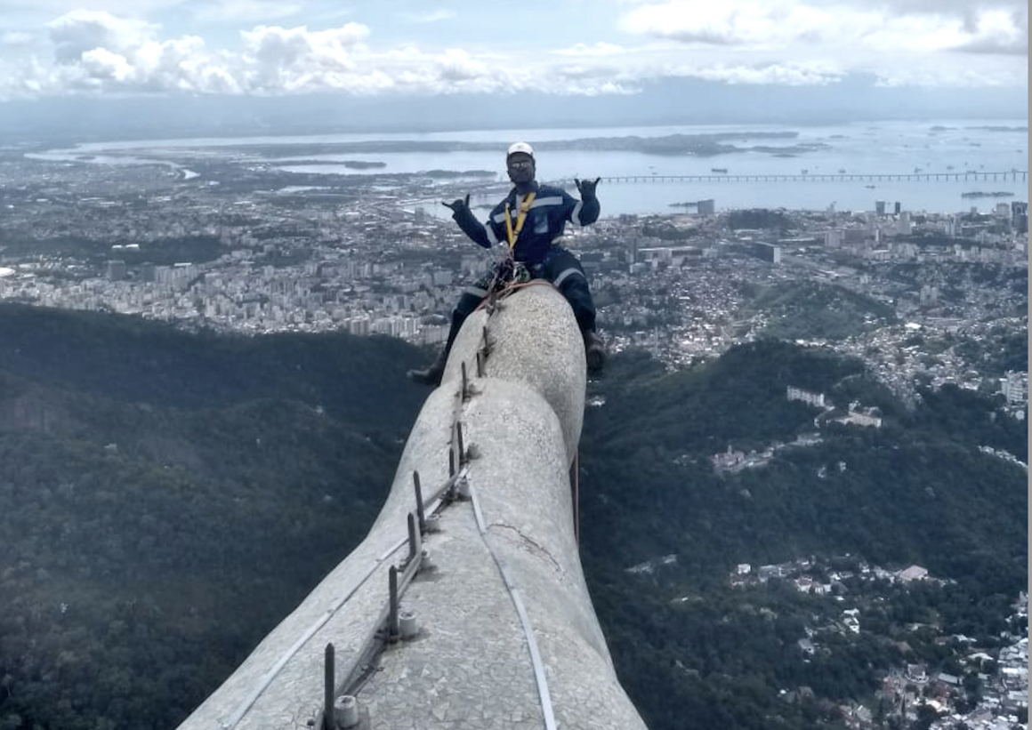 Alexsandro Brauna works on the safety team for the Christ the Redeemer restoration project. The spikes along the statue's arms are lightning rods. 