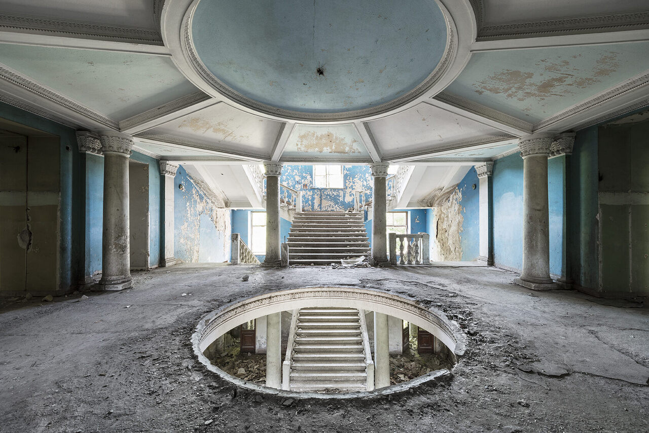 The grand entrance hall inside a neglected sanatorium in Georgia. This building is slated to be redeveloped into a luxurious hotel. 