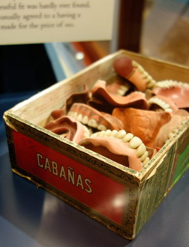 Displays at the Weaver Dental Museum include a jumble of dentures.